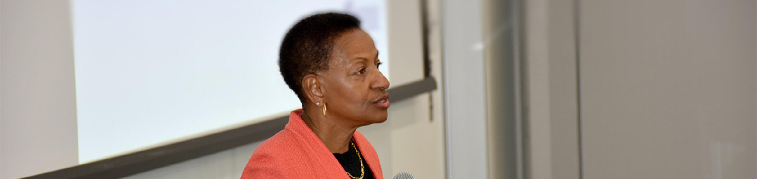 VC and Dean Deas speaking in front of an audience