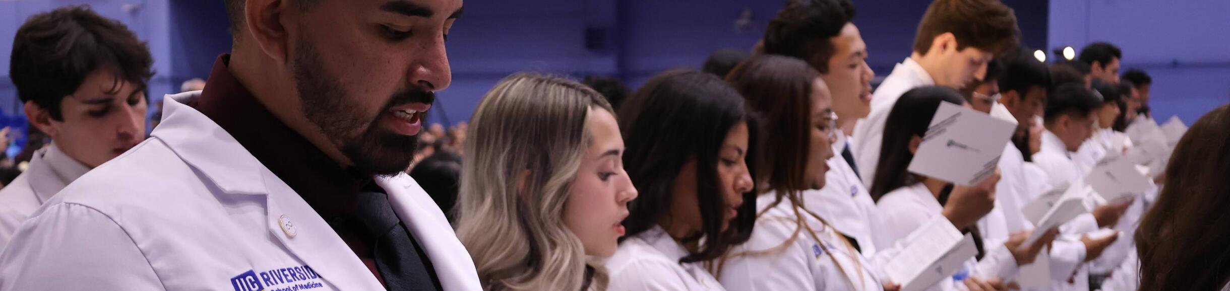 students at white coat ceremony