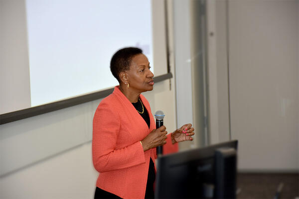 VC and Dean Deas speaking in front of an audience