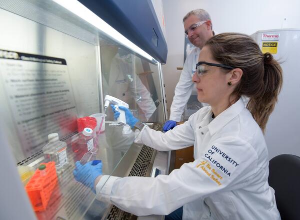 Scott Pegan and student at a fume hood