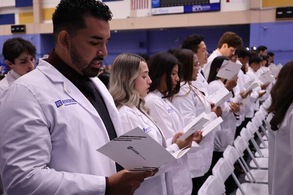 students at white coat ceremony