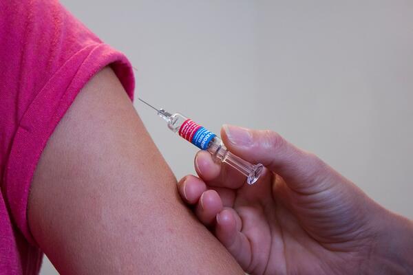 person getting a vaccine shot